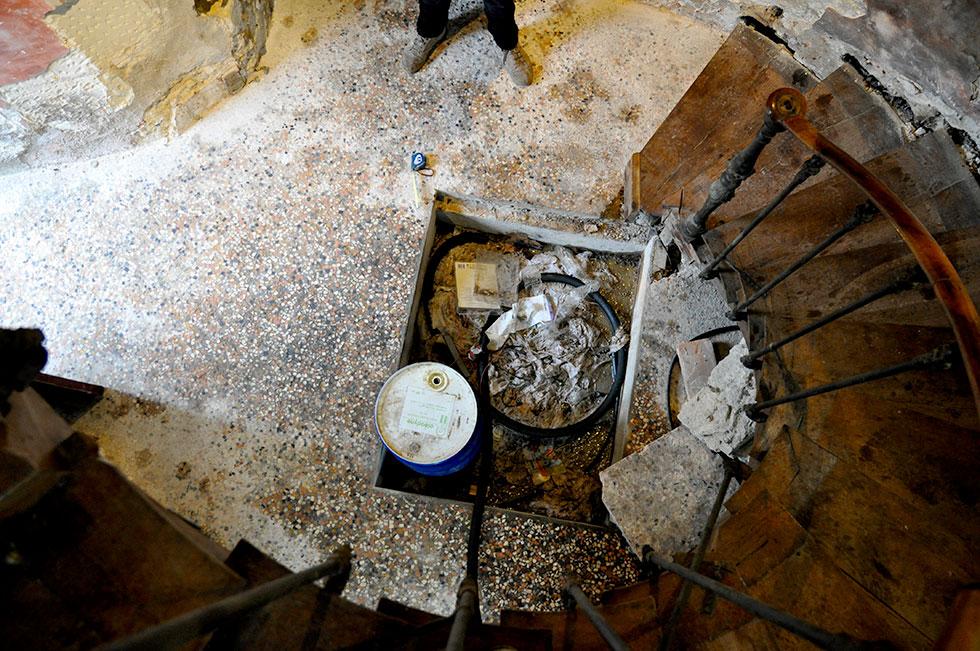 oil stained mosaic floor, calcite deposit